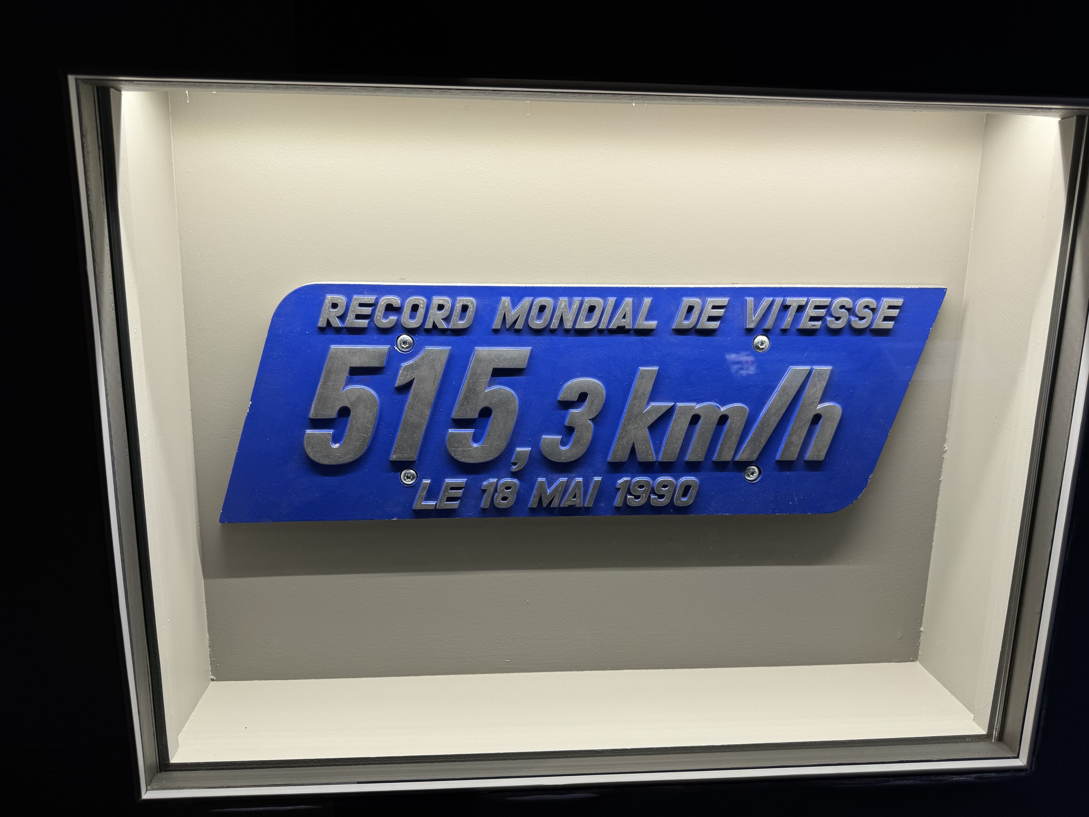 A metal plaque that was attached to the carriages of unit 325 commemorating the speed record of 515.3 km/h A metal plaque that was attached to the carriages of unit 325 commemorating the speed record of 515.3 km/h